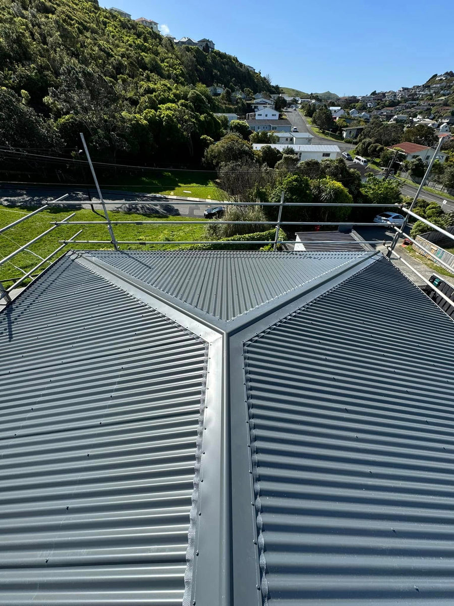 Charcoal longrun with hip and valley flashings