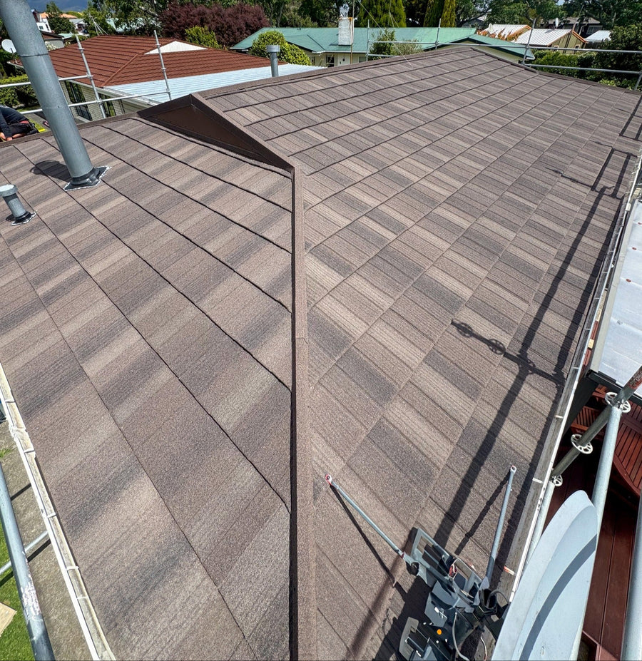 Brown metal tile roof with ridge flashing